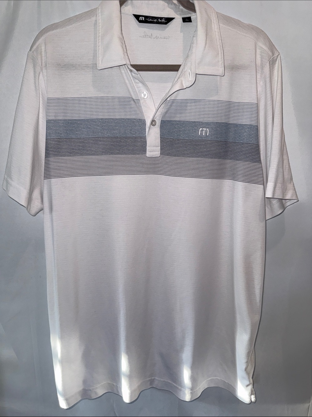 Travis Mathew White Polo with Horizontal Gray Stripe